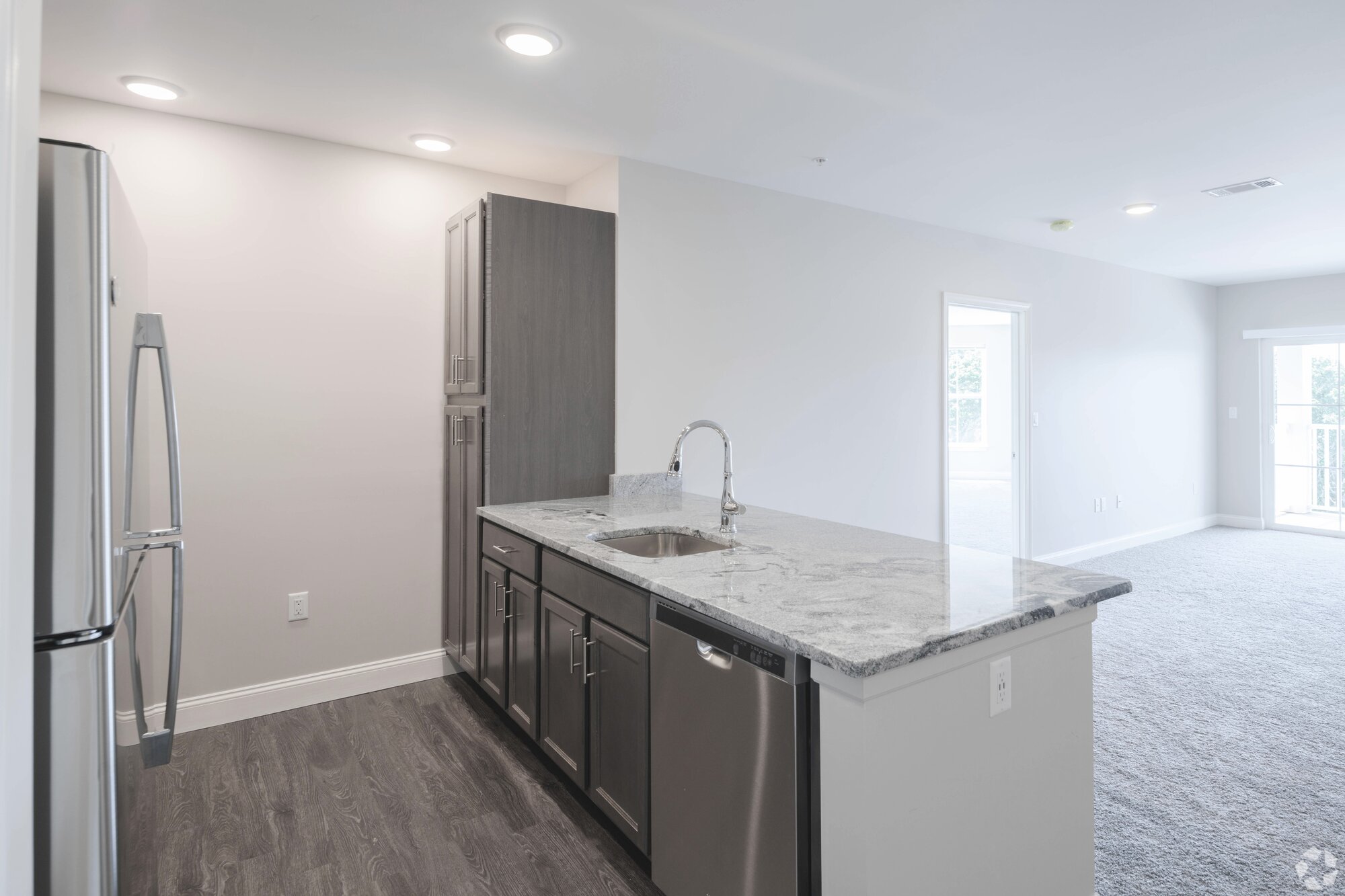 2-bedroom kitchen with stainless appliances and granite counters.